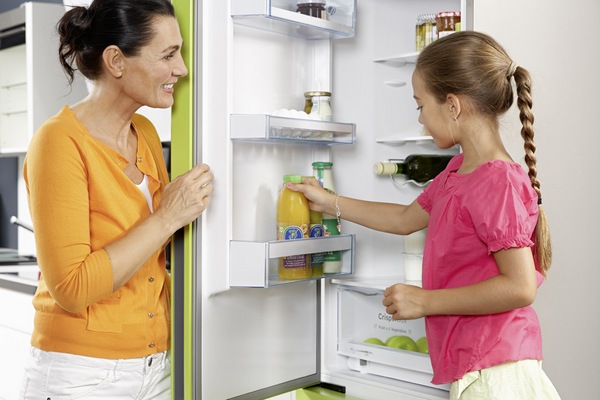  Woman and child at the open refrigerator