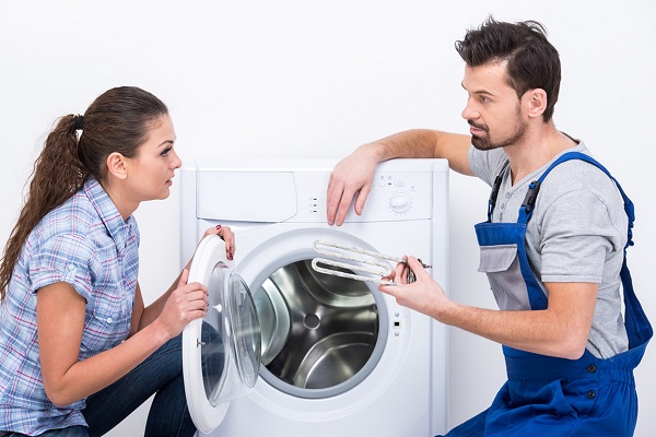  A man and a woman near the washing machine