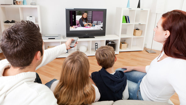  Family in the living room watching television