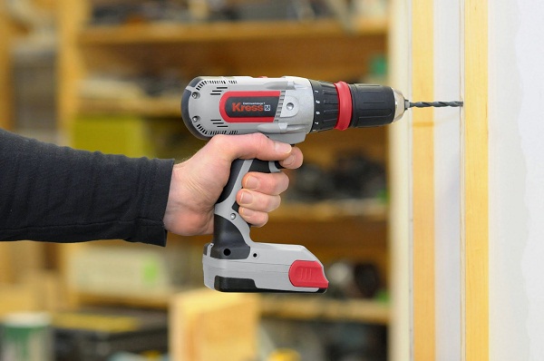  Drilling a wall with a drill