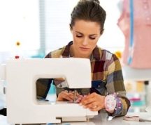  Girl sews on the sewing machine