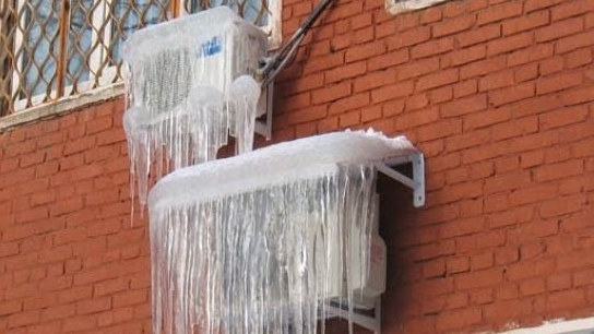  Outdoor unit air conditioner covered with ice