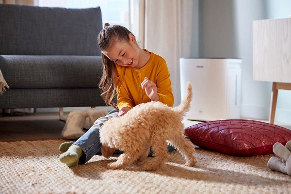  Girl playing with a puppy