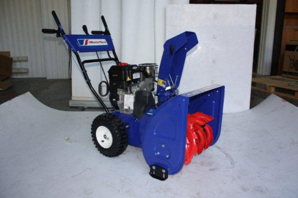  Self-propelled wheeled snow blower