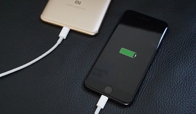  Smartphone charges another gadget