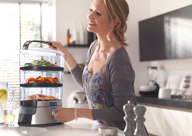  The girl cooks in a double boiler